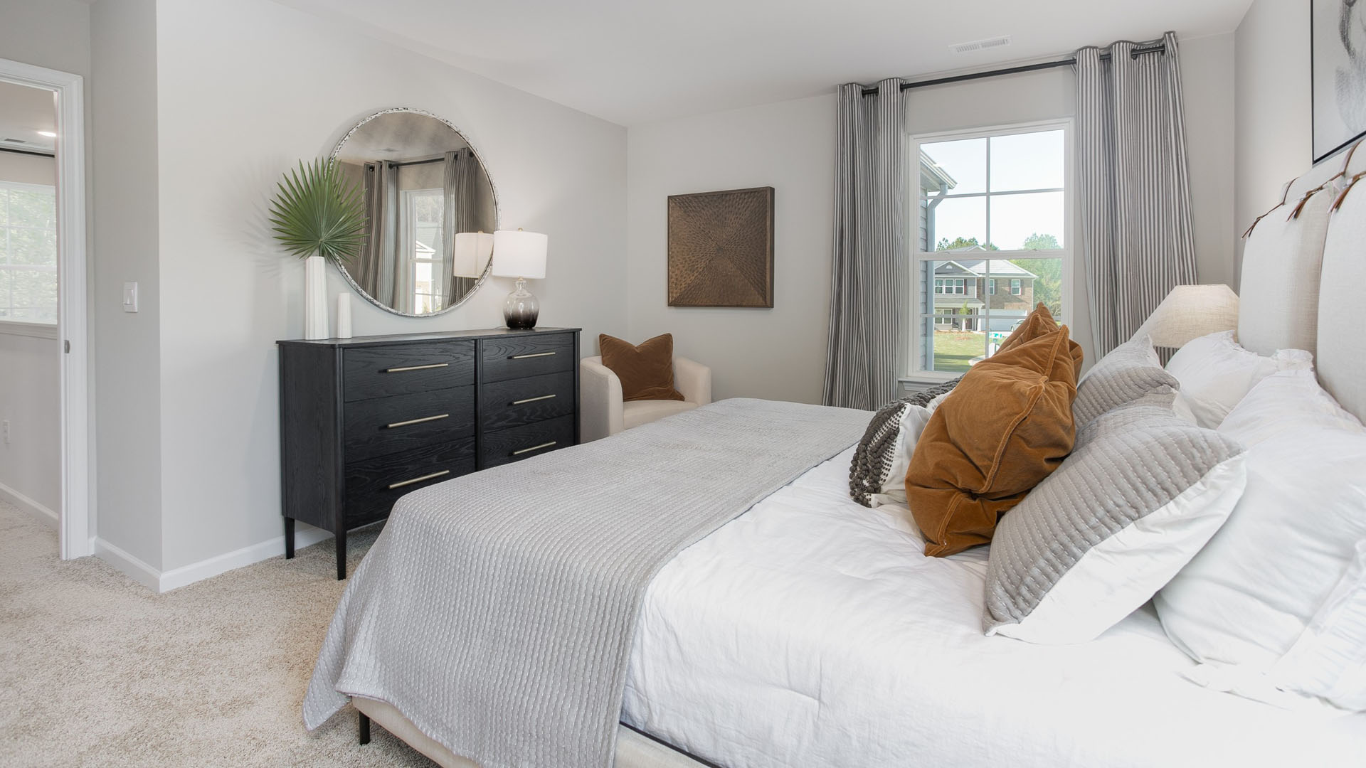 bedroom with carpet and natural light
