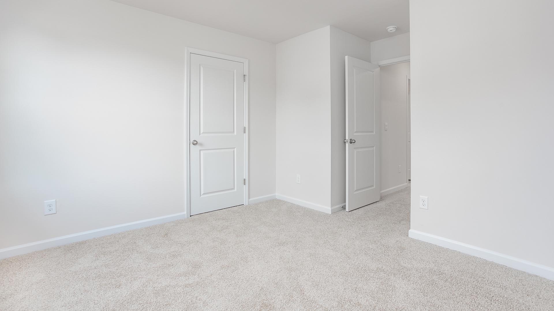 bedroom with carpet and natural light