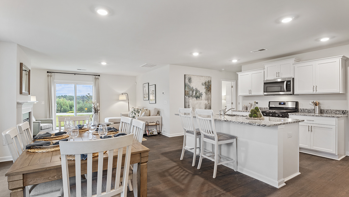 kitchen with island, vinyl floor, and stainless steel appliances