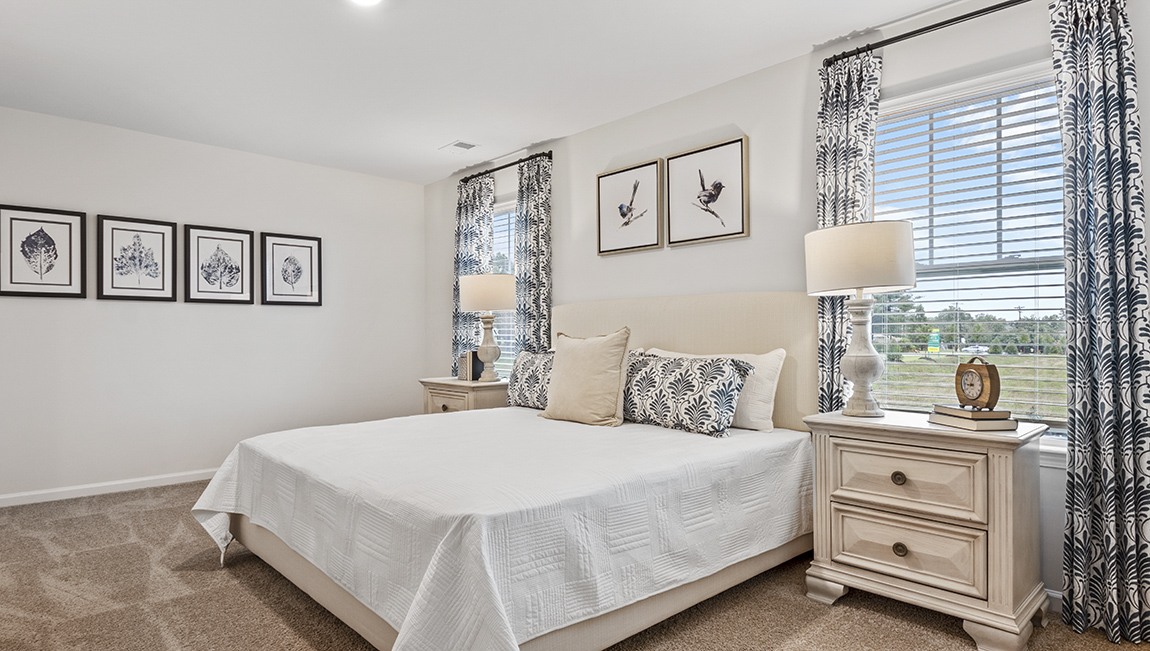 Bedroom with carpet and natural light