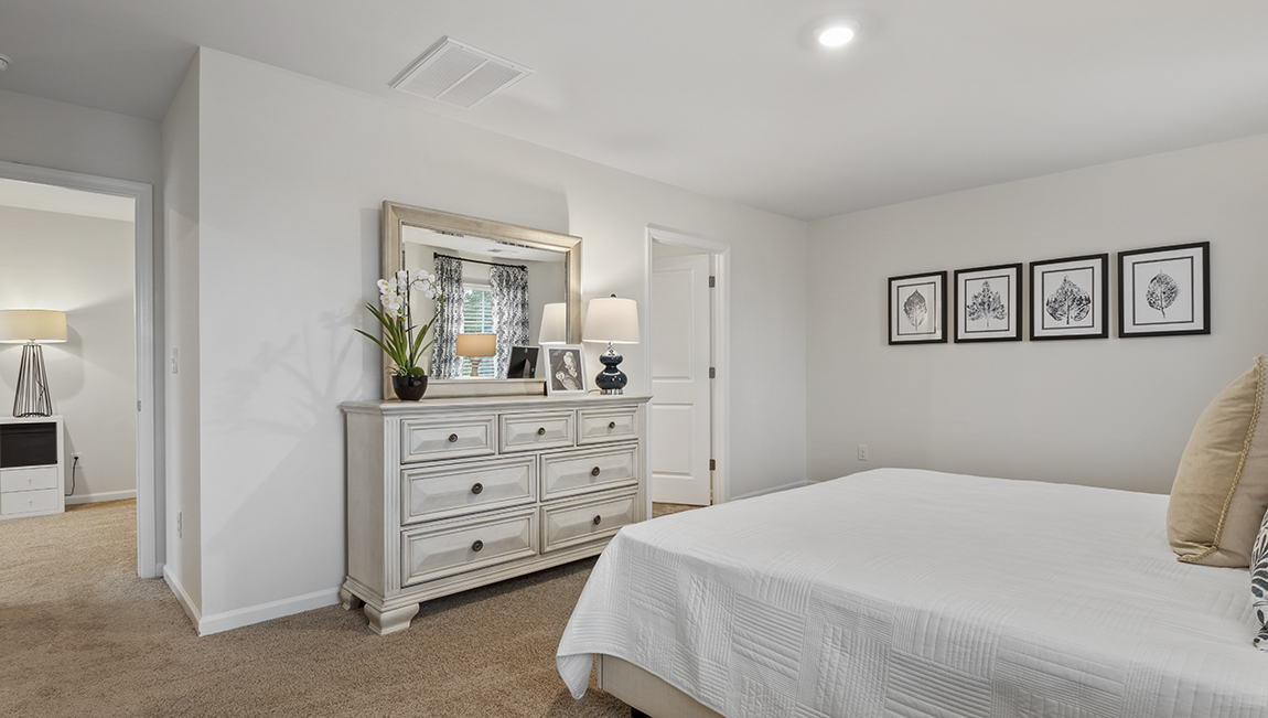 Bedroom with carpet and natural light