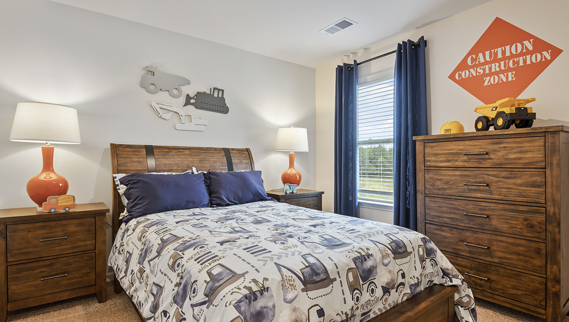 Bedroom with carpet and natural light