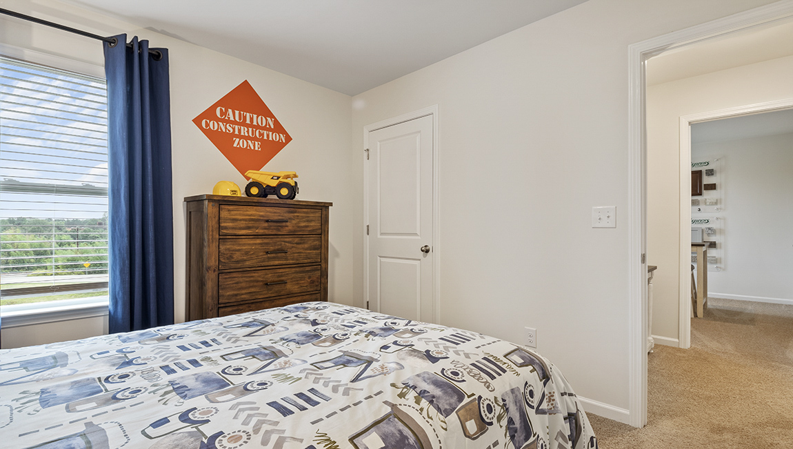 Bedroom with carpet and natural light