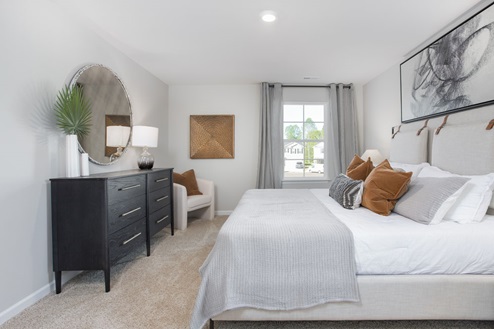 bedroom with carpet and natural light