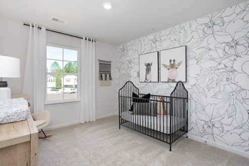 bedroom with carpet and natural light