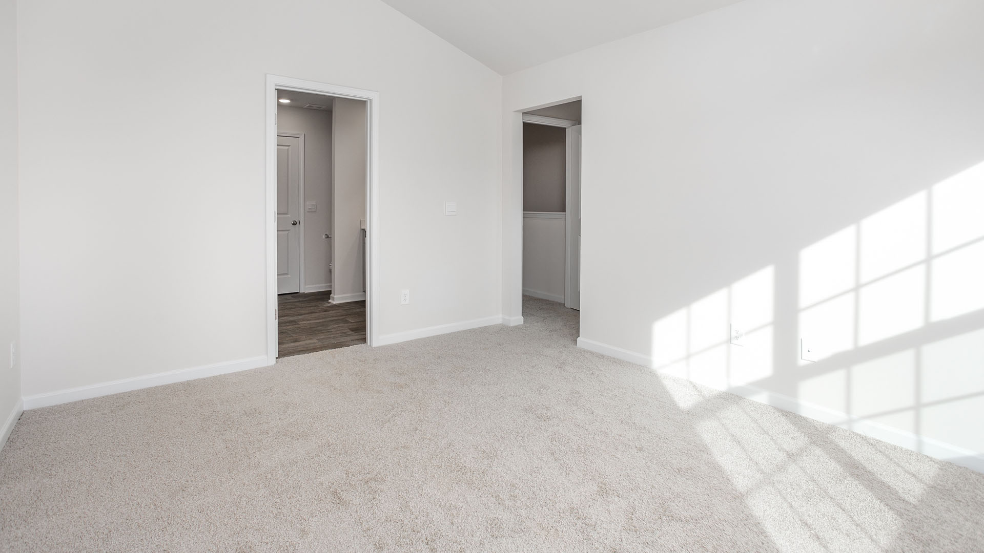 bedroom with carpet and natural light