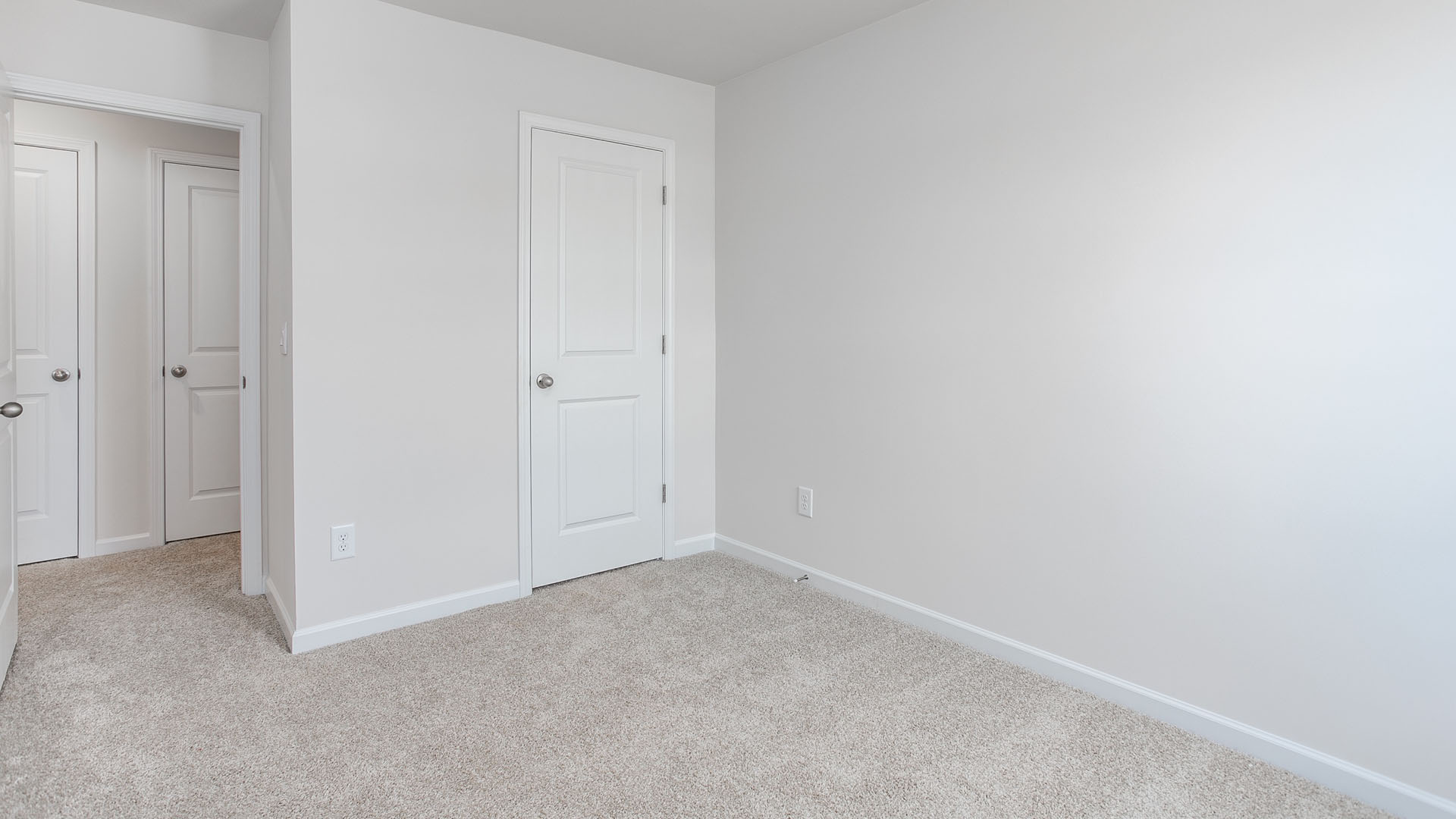 bedroom with carpet and natural light