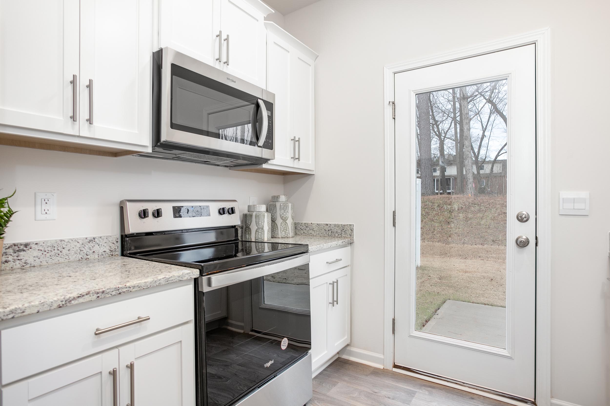 kitchen with vinyl floor and stainless steel appliances