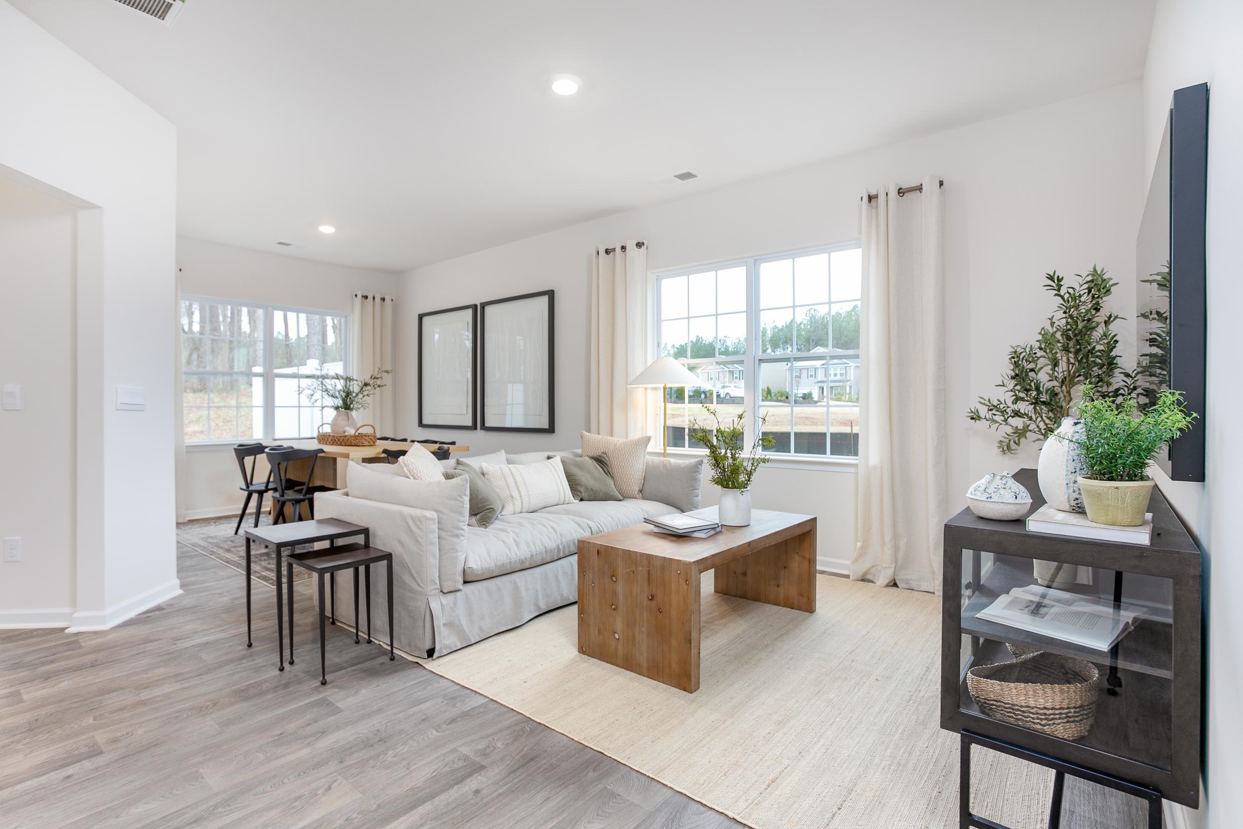 living room with vinyl floor and natural light