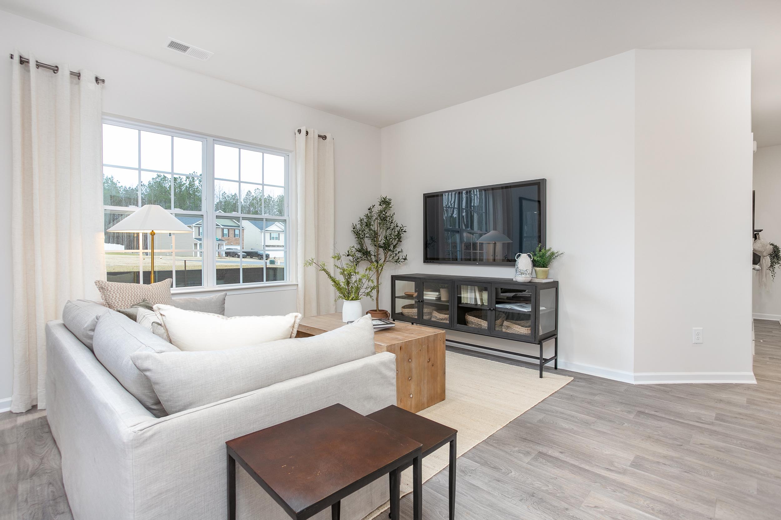 living room with vinyl floor and natural light