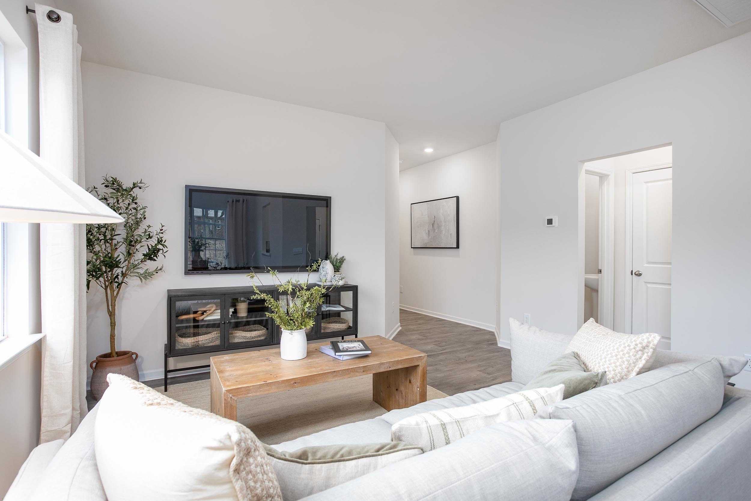 living room with vinyl floor and natural light