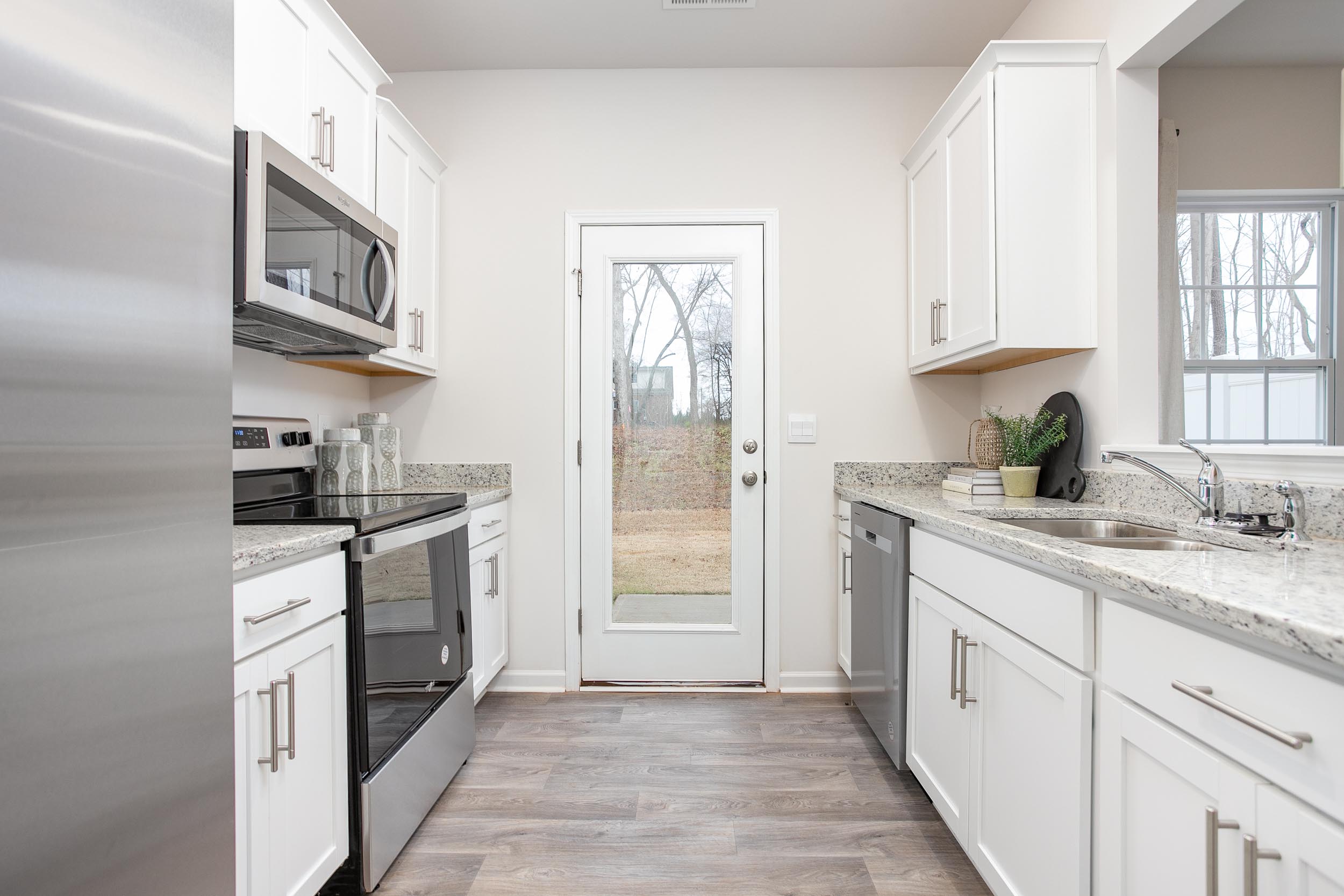 kitchen with vinyl floor and stainless steel appliances