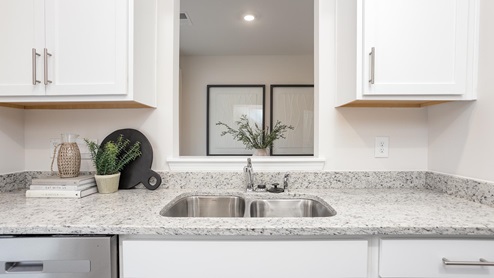 kitchen with vinyl floors and stainless steel appliances