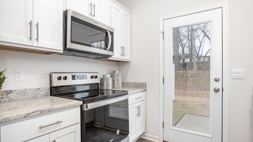 kitchen with vinyl floors and stainless steel appliances