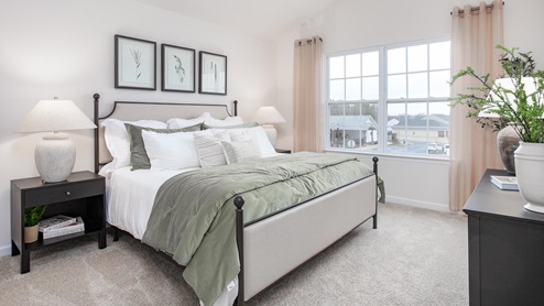 bedroom with carpet and natural light
