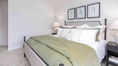 bedroom with carpet and natural light
