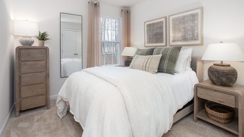 bedroom with carpet and natural light