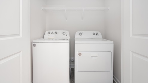 laundry room with shelfs