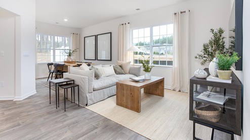 living room with vinyl floors and natural light