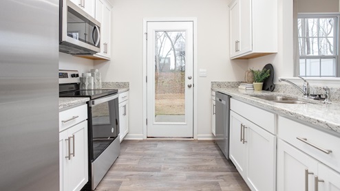 kitchen with vinyl floors and stainless steel appliances