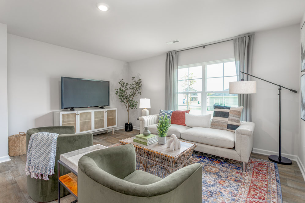 living room with vinyl floors and natural light
