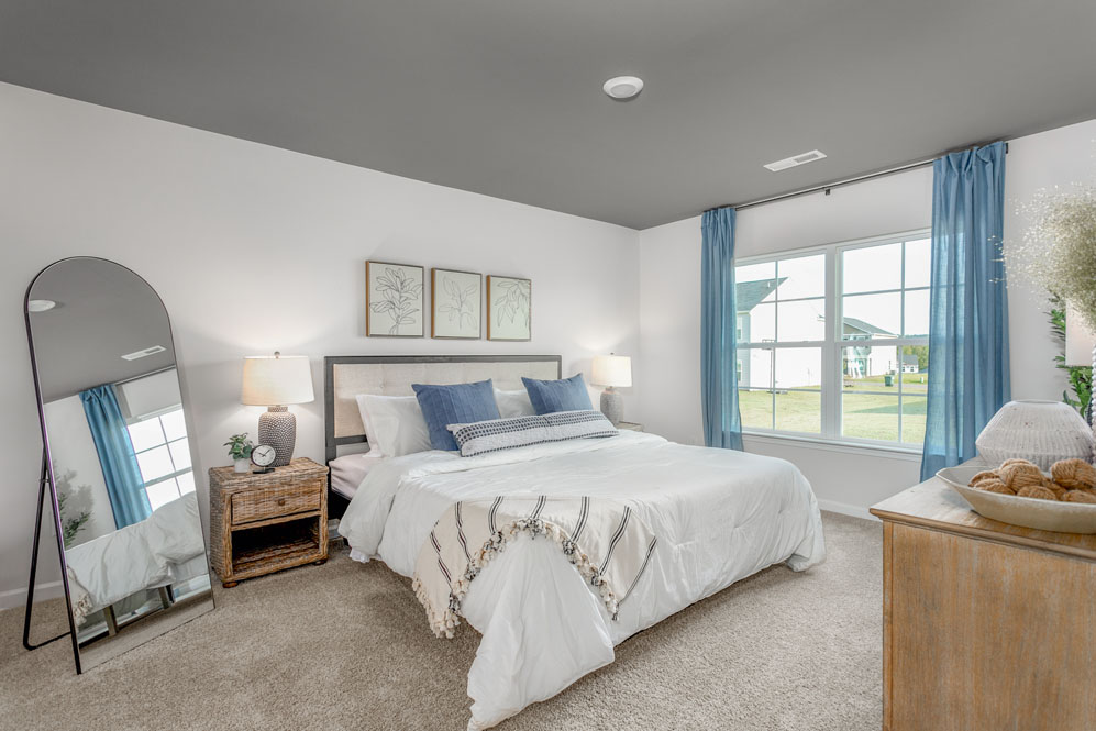 bedroom with carpet and natural light