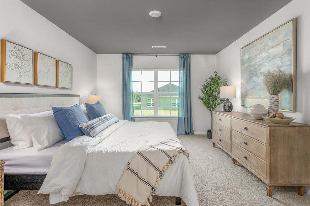 bedroom with carpet and natural light
