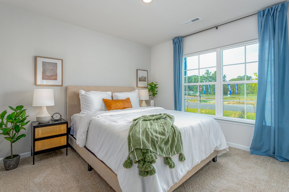 bedroom with carpet and natural light