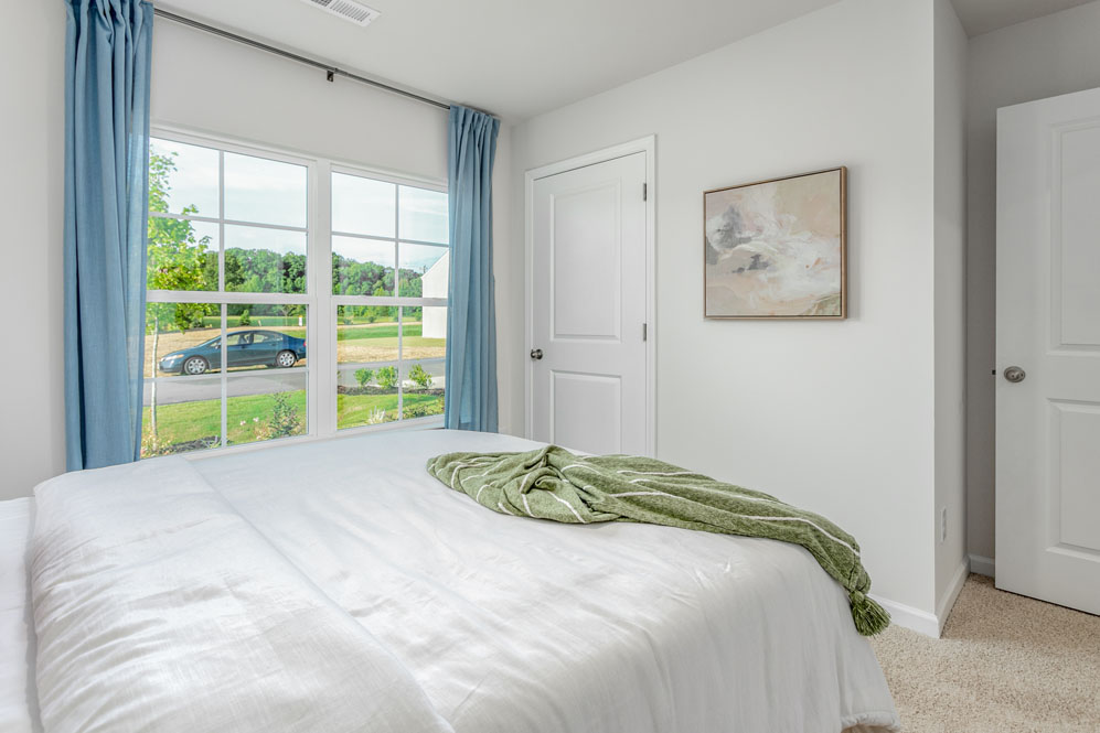 bedroom with carpet and natural light