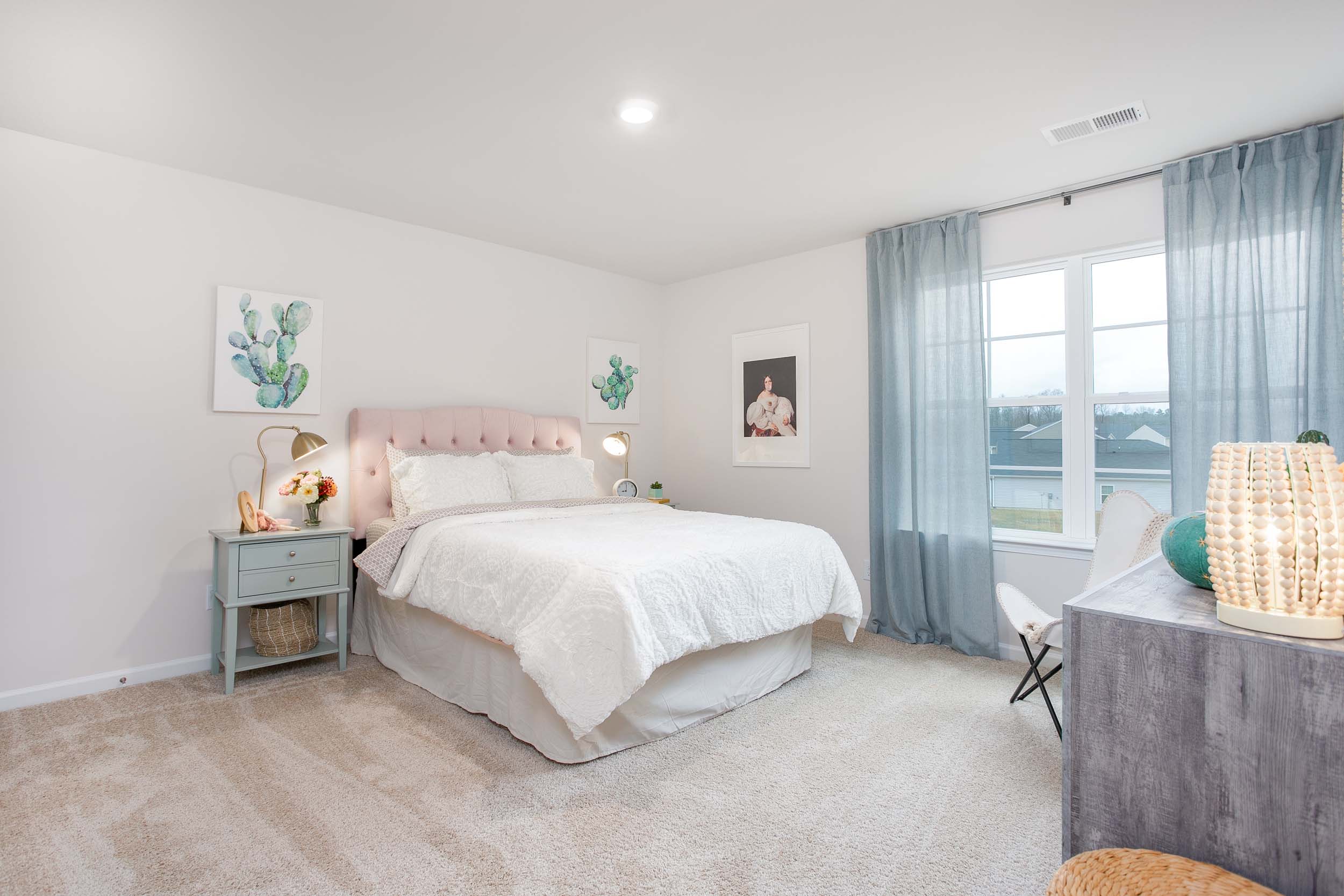 bedroom with carpet and natural light