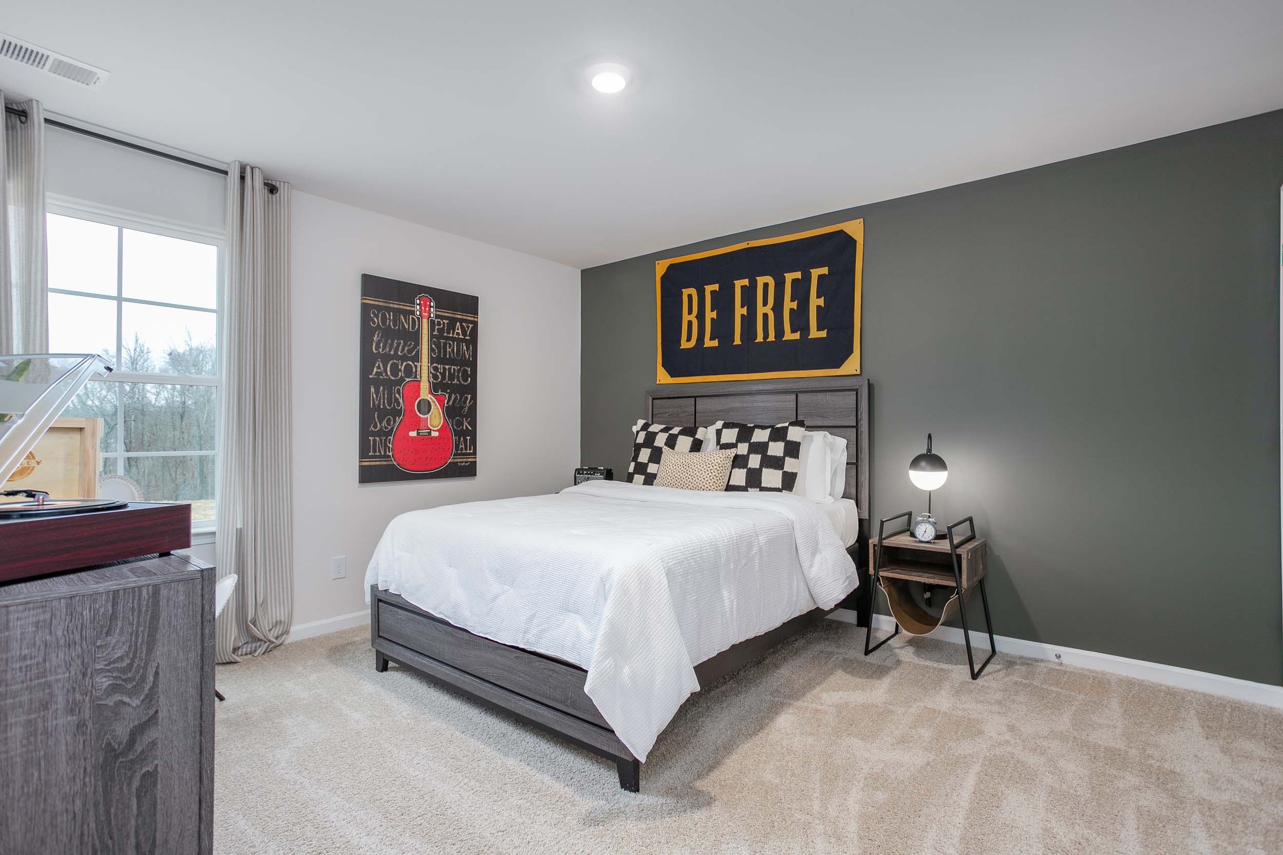 bedroom with carpet and natural light