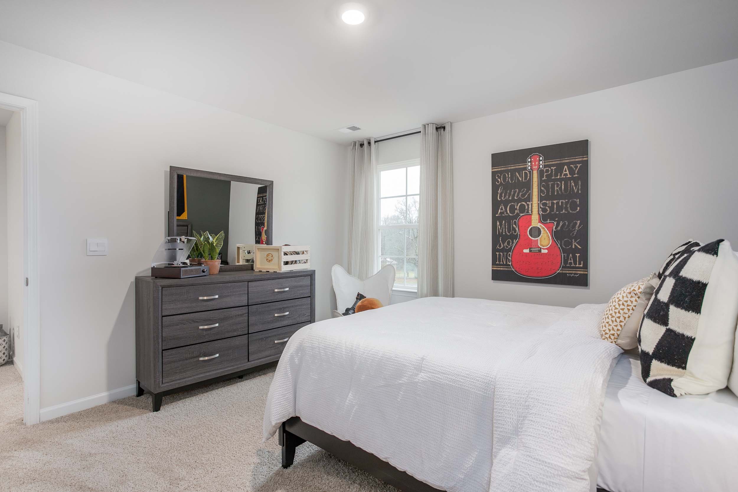 bedroom with carpet and natural light