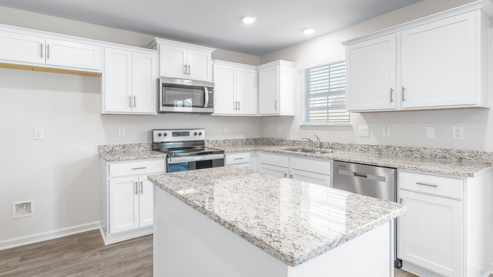 kitchen with island and vinyl floor