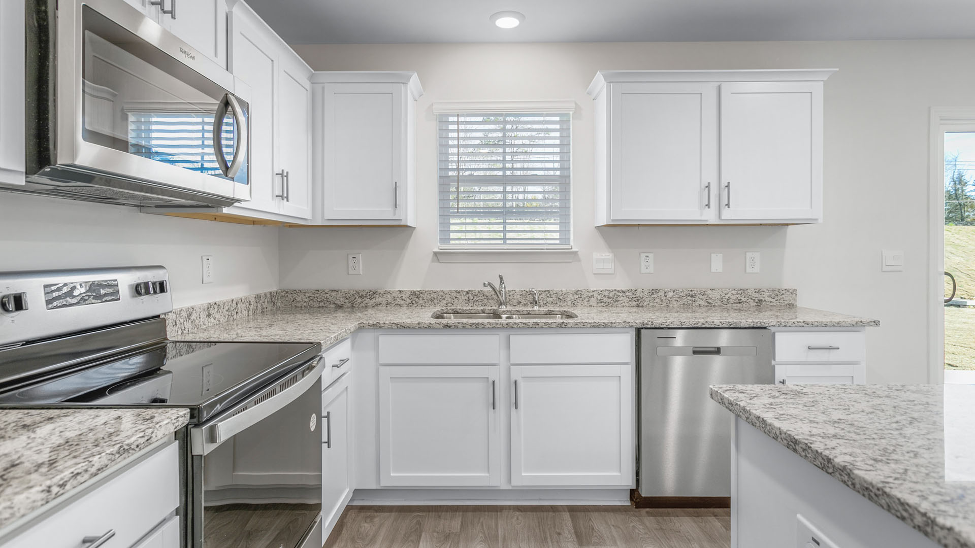 kitchen with island and vinyl floor