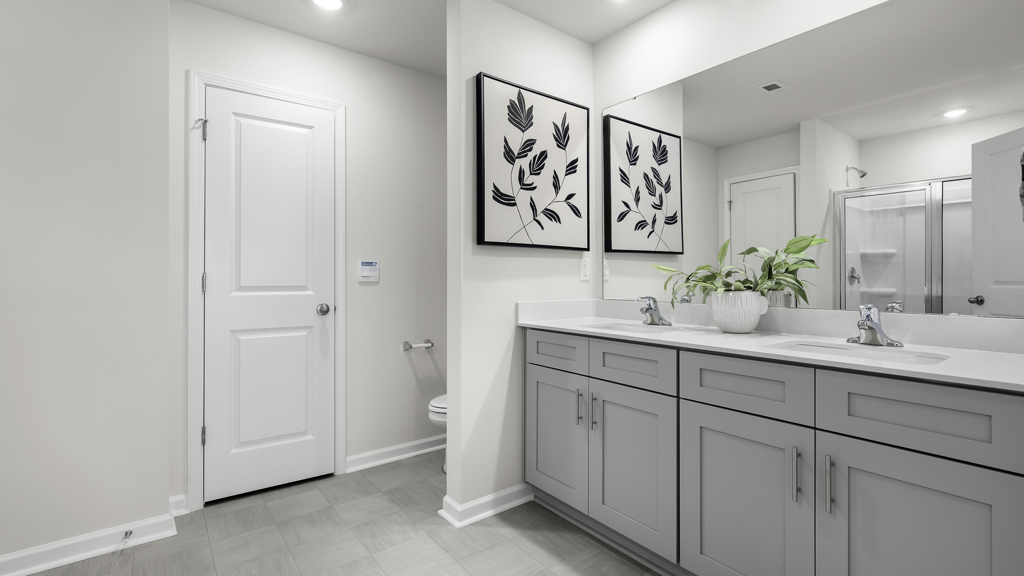 primary bathroom with dual sinks