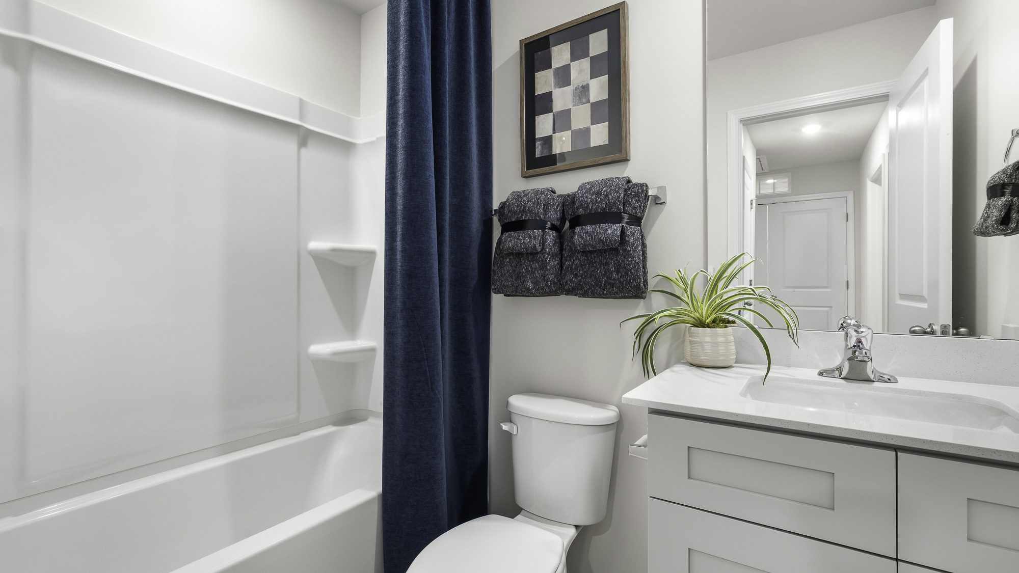 secondary bathroom with tub shower combo
