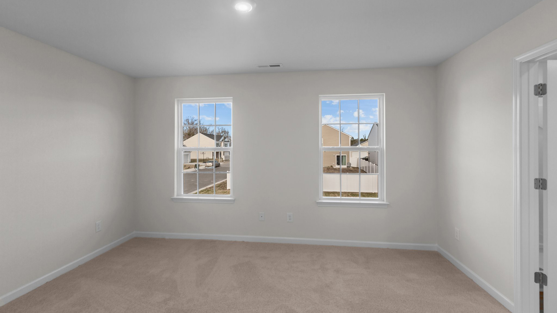 Bedroom with carpet and natural light