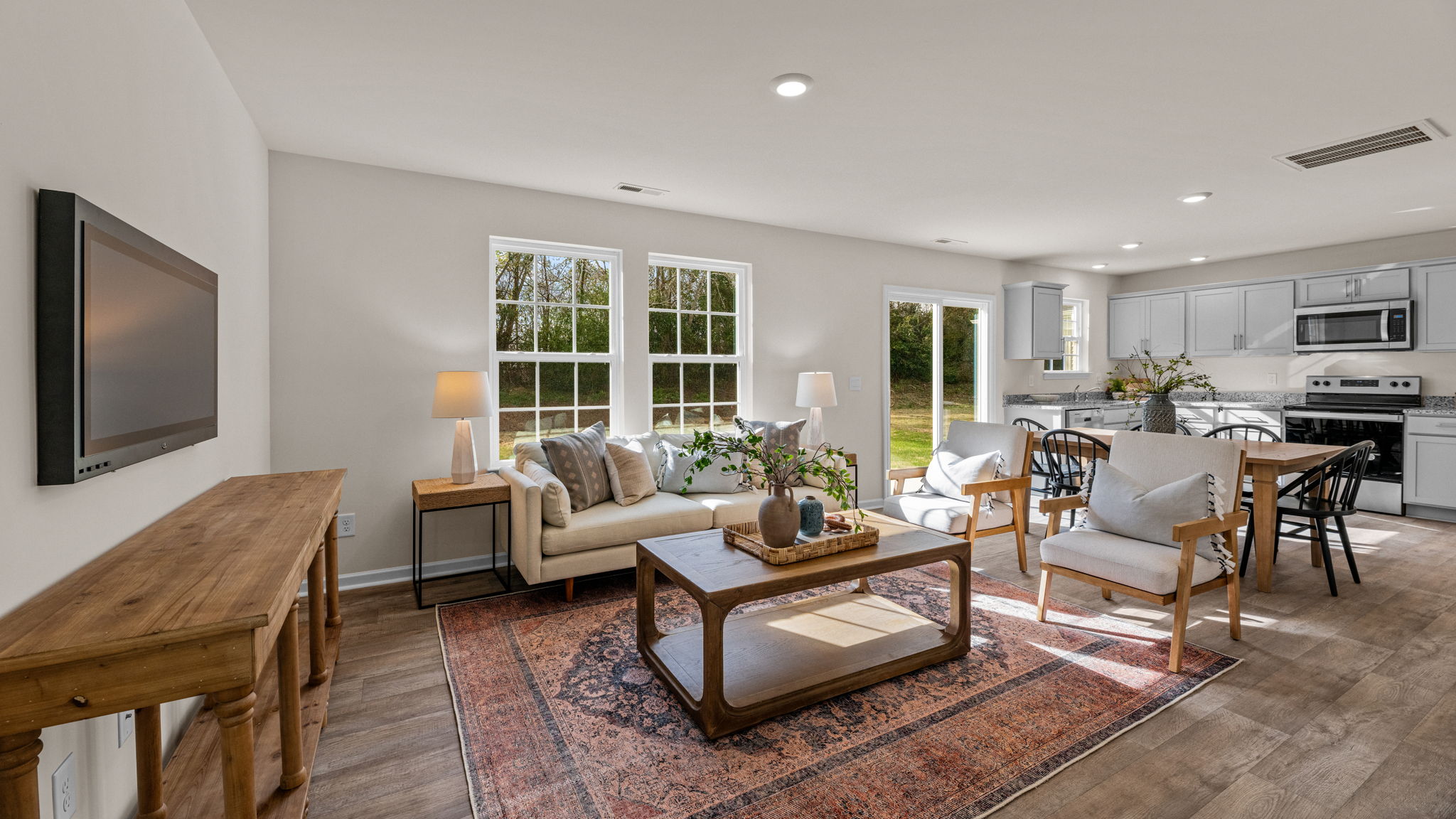 living room with vinyl floor and natural light