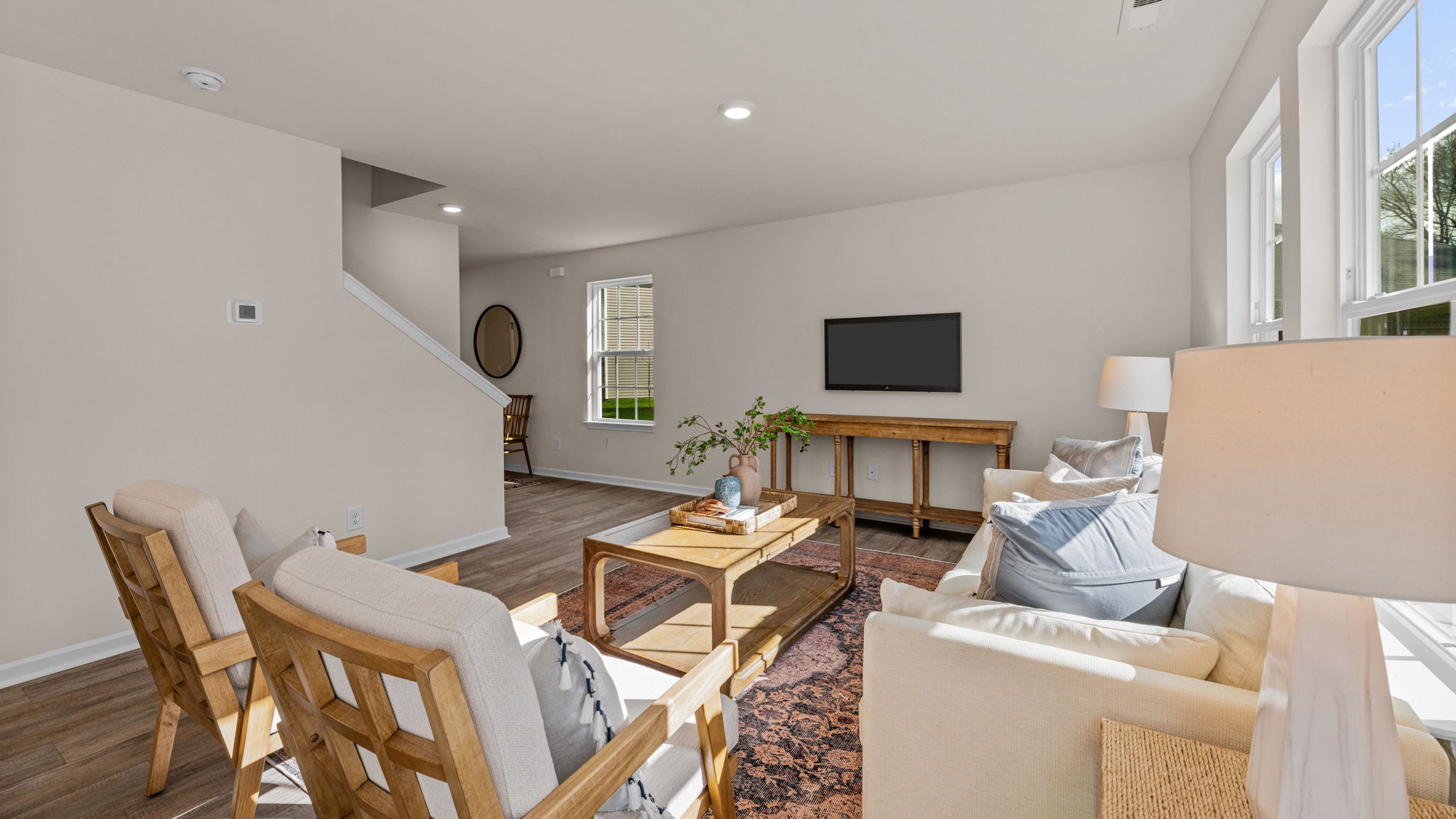living room with vinyl floor and natural light