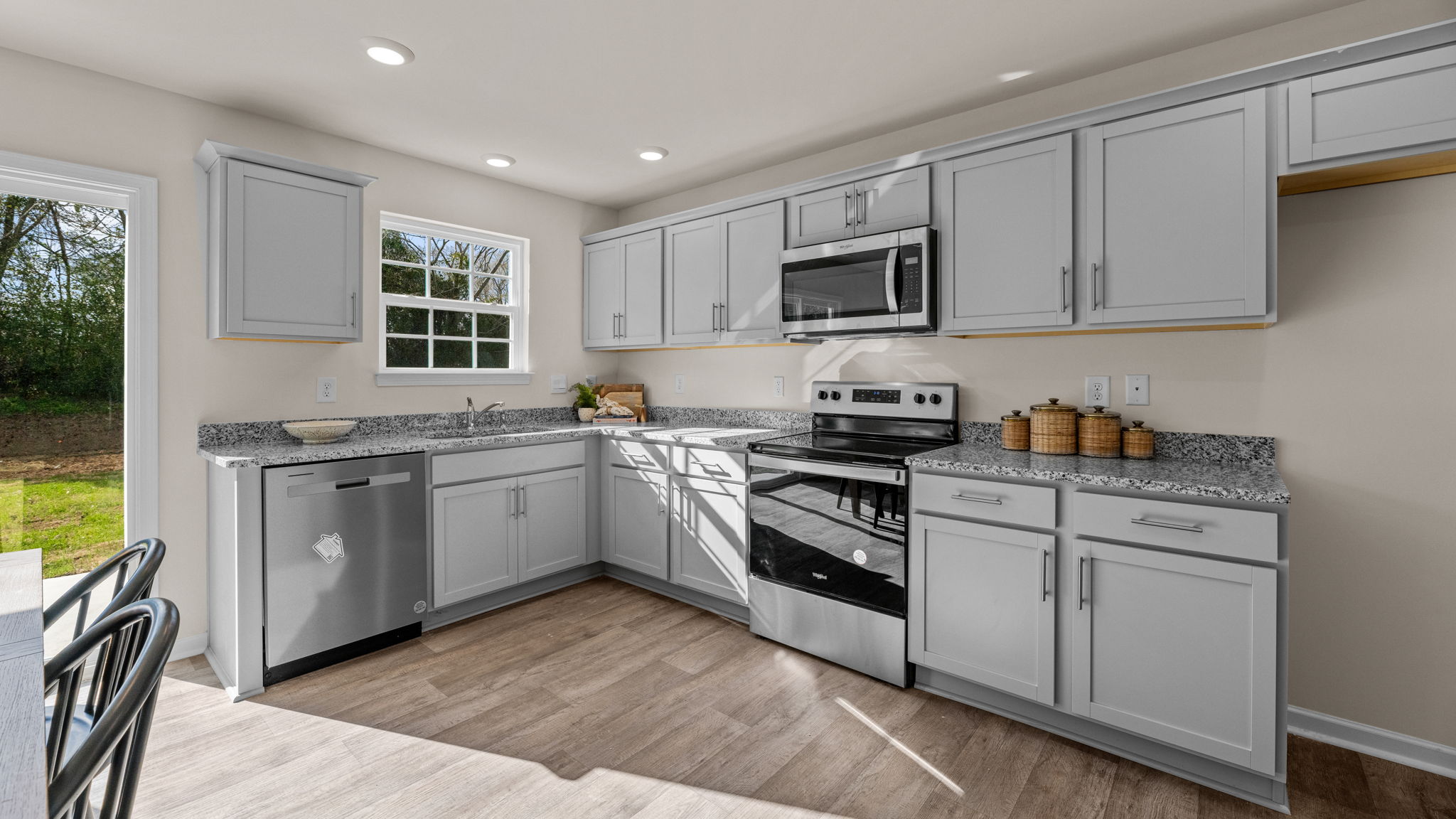 kitchen with vinyl floor and stainless steel appliances