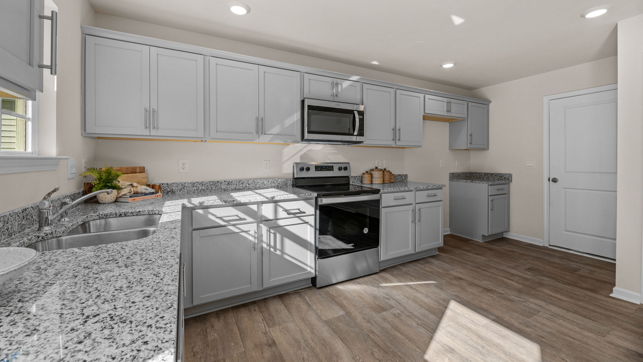 kitchen with vinyl floor and stainless steel appliances
