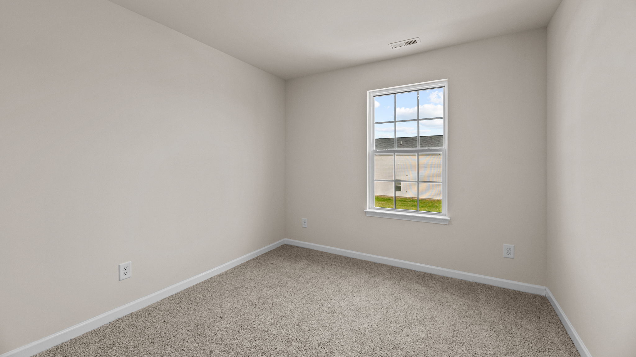 bedroom with carpet and natural light