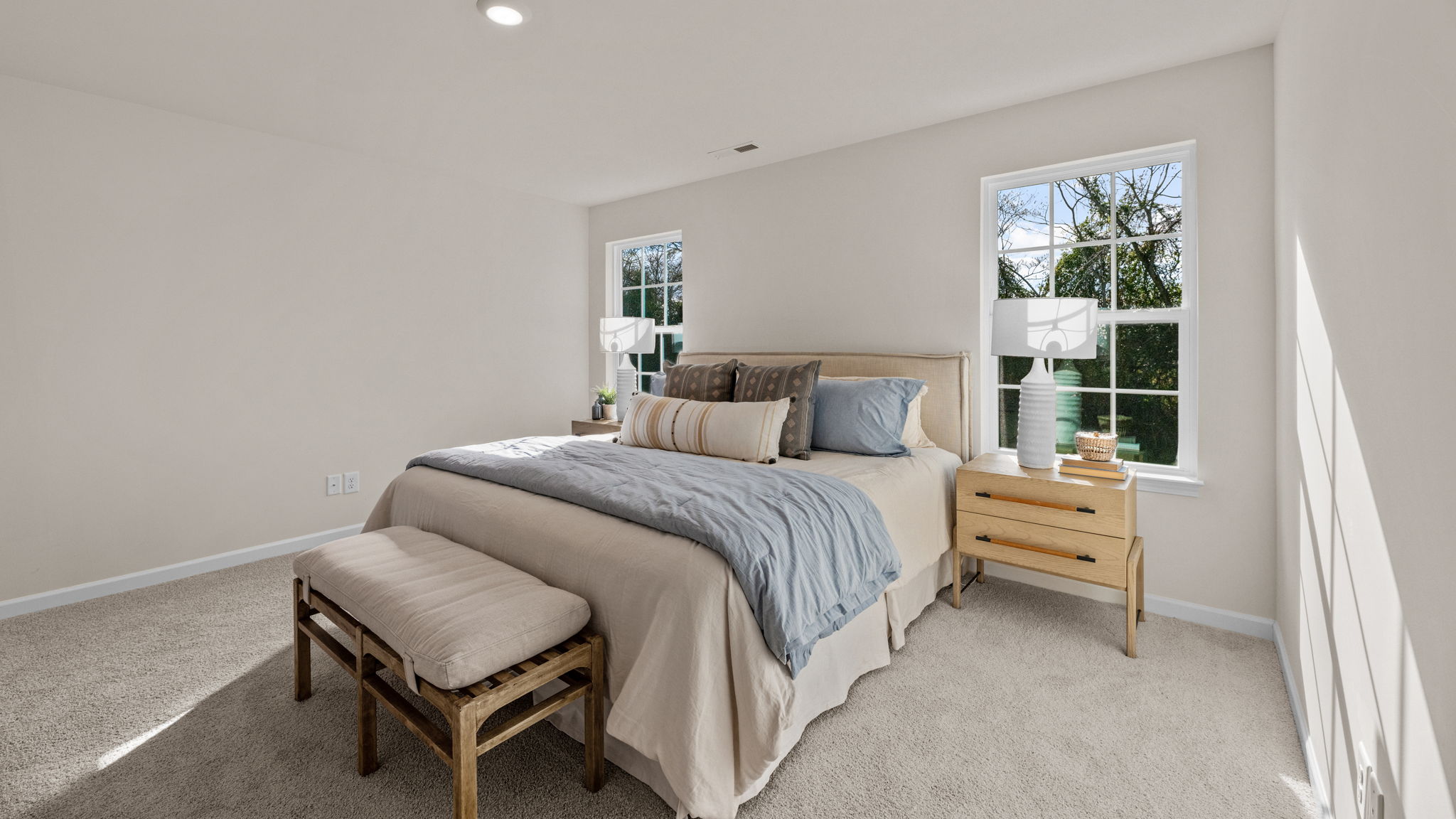 bedroom with carpet and natural light