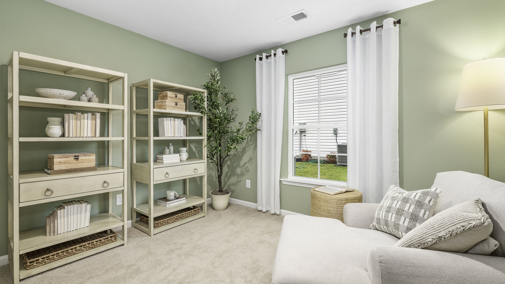 secondary bedroom with window and carpet
