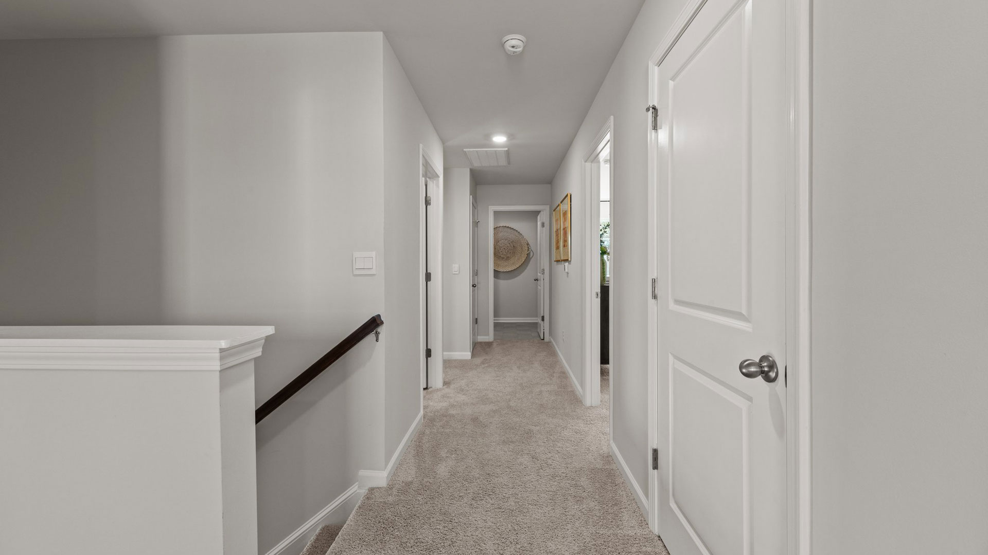 upstairs hallway with carpet