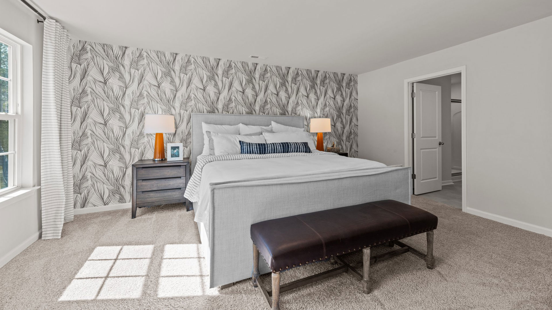 bedroom with carpet and natural light