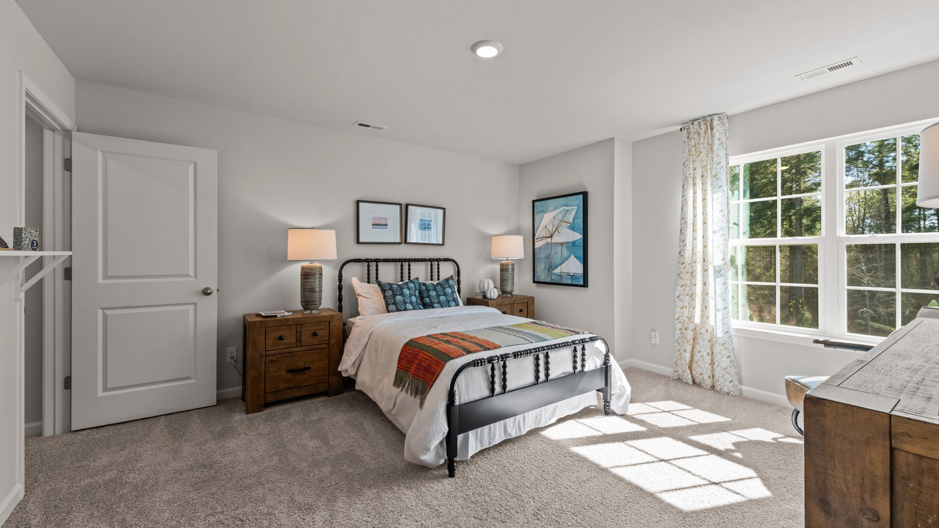 bedroom with carpet and natural light