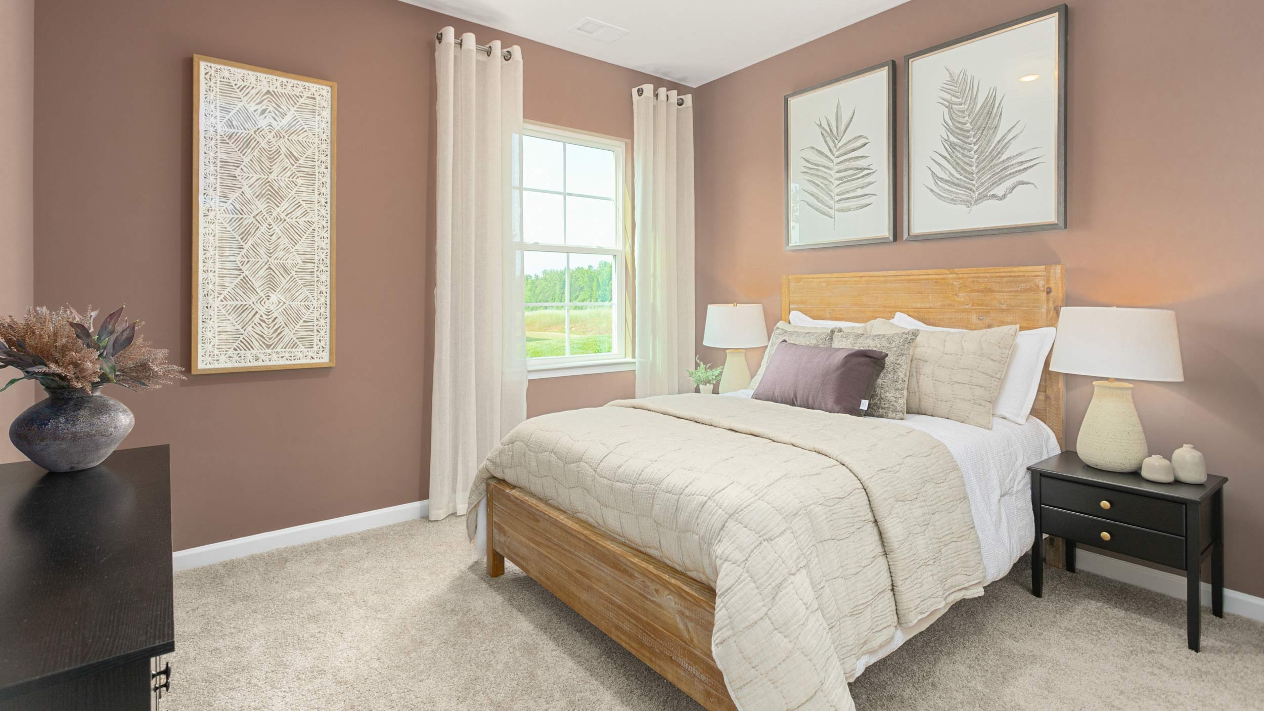 bedroom with carpet and natural light