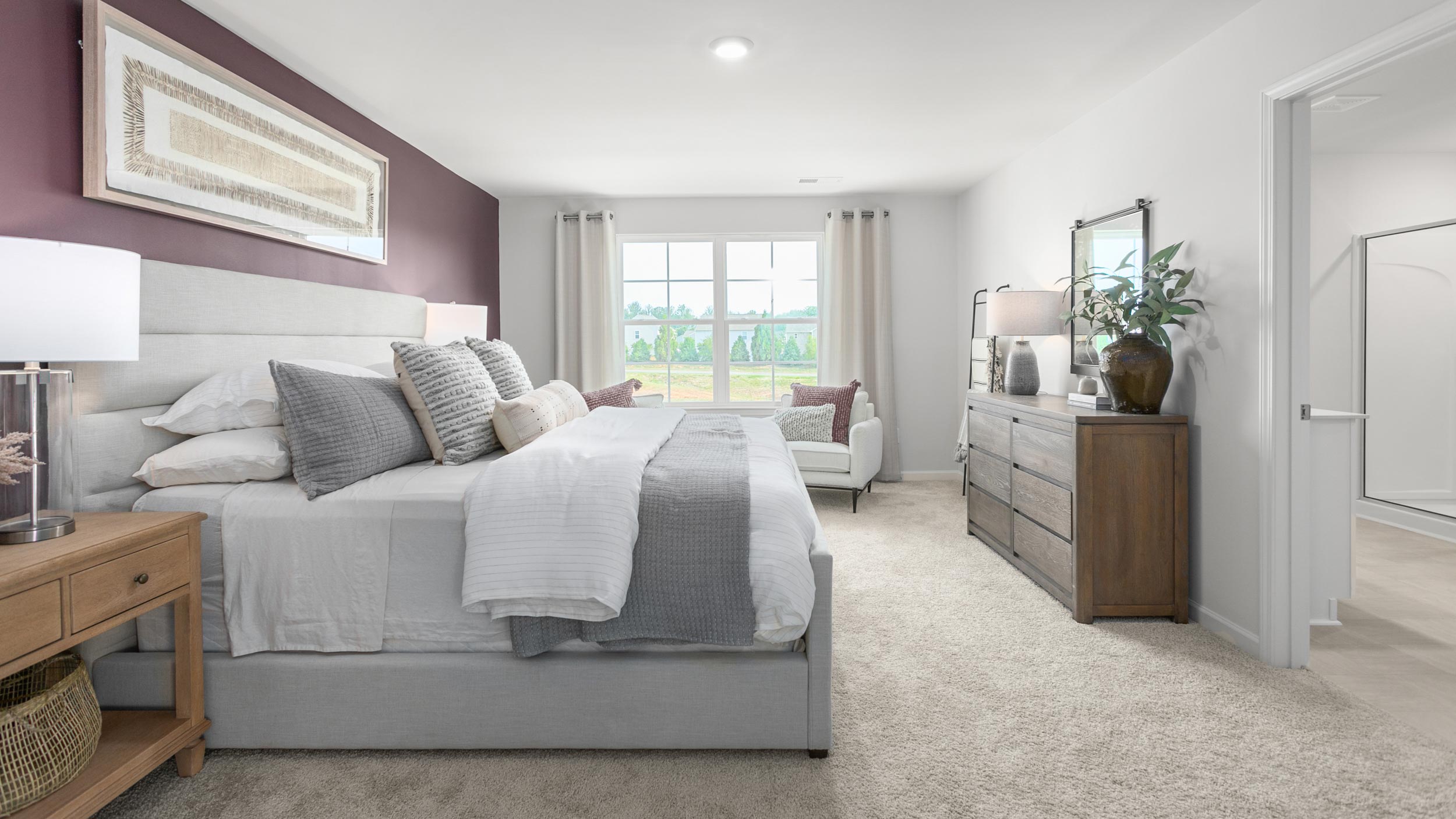 bedroom with carpet and natural light