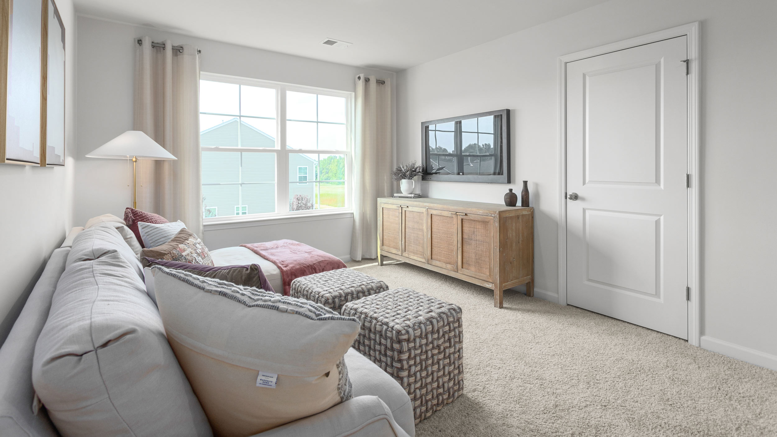 Loft with carpet and natural light